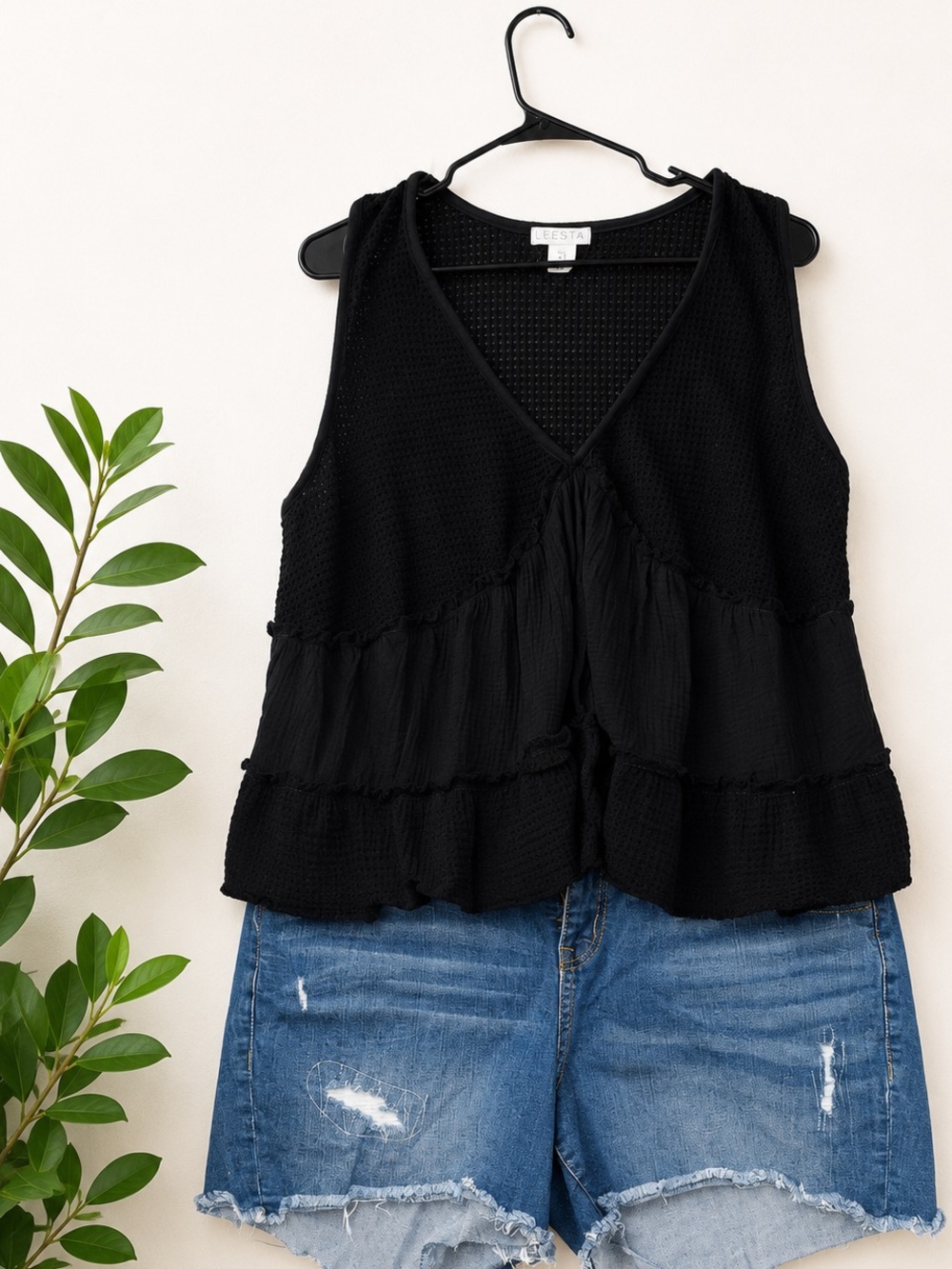 Torrid distressed jeans shorts with black flowy tank -